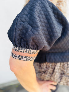 Can't Be Tamed Textured Short Puff Sleeve Top Featuring Animal Pattern contrast Ruffle Hem